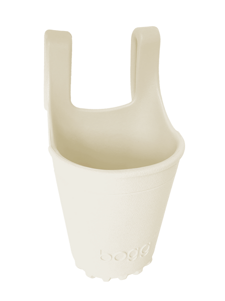 Bogg® Bevy drink and accessory holder attached to a Bogg® Bag, securely holding a cup. Perfect for carrying drinks, keys, snacks, and more on the go.