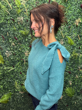 Style | Off-Shoulder Sweater
Color | Green
Neckline | Off-shoulder
Sleeves | Lantern sleeves with bow tie detail
Fabric | Elastane (Spandex) blend — soft, stretchy knit
Fit | Fitted through the body with a flowy sleeve silhouette
Care | Hand wash cold or machine wash gentle, lay flat to dry
