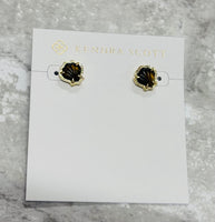 Beach babes, the Brynne Gold Shell Stud Earrings in Golden Obsidian are the perfect petite, sea-inspired touch. Shell stones in a textured frame add cute flair!
