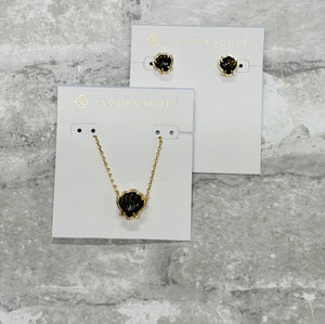 Beach babes, the Brynne Gold Shell Stud Earrings in Golden Obsidian are the perfect petite, sea-inspired touch. Shell stones in a textured frame add cute flair!