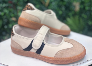 Meet the sneaker that makes everyday outfits feel instantly more pulled together. The Corkys Calm Down Mary Jane features a soft Sand Combo palette with creamy ivory panels, warm sand-toned texture, and a playful leopard-print accent at the heel. A tan sole grounds the look, while the classic Mary Jane strap keeps the silhouette feminine and easy to wear.