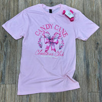 Pink t-shirt with candy cane and bow design.