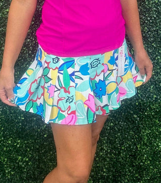 Fresh, flirty, and made for sunny days, the Caryn Pleated Skort – Spring Fling blends feminine style with performance comfort. Designed with a flattering pleated silhouette, this skort adds easy movement and polish to any outfit. Crafted from UPF 50 sun-protective fabric, it helps shield your skin while keeping you cool and comfortable.