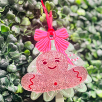 Festive acrylic Christmas claw clips in tree, gingerbread man, present, and snowman designs. Perfect for holiday hairstyles!