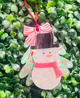 Festive acrylic Christmas claw clips in tree, gingerbread man, present, and snowman designs. Perfect for holiday hairstyles!
