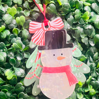 Festive acrylic Christmas claw clips in tree, gingerbread man, present, and snowman designs. Perfect for holiday hairstyles!