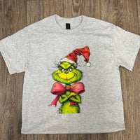 Christmas Grinch t-shirt

Grinch Santa hat tee

Holiday graphic tee

Unisex Christmas shirt

Gildan polyblend tee

Festive Grinch bow tie design

Screenprint Christmas shirt

Holiday short sleeve tee

Fun Christmas apparel

Cozy seasonal t-shirt