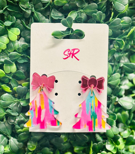 Add a playful pop to your holiday style with these Multicolored Acrylic Tree Dangle Earrings! Bursting with bright color and topped with a shiny pink mirrored bow, they’re the perfect choice for a funky and fun Christmas look. Lightweight, hypoallergenic, and nickel-free—so you can celebrate in comfort and style.