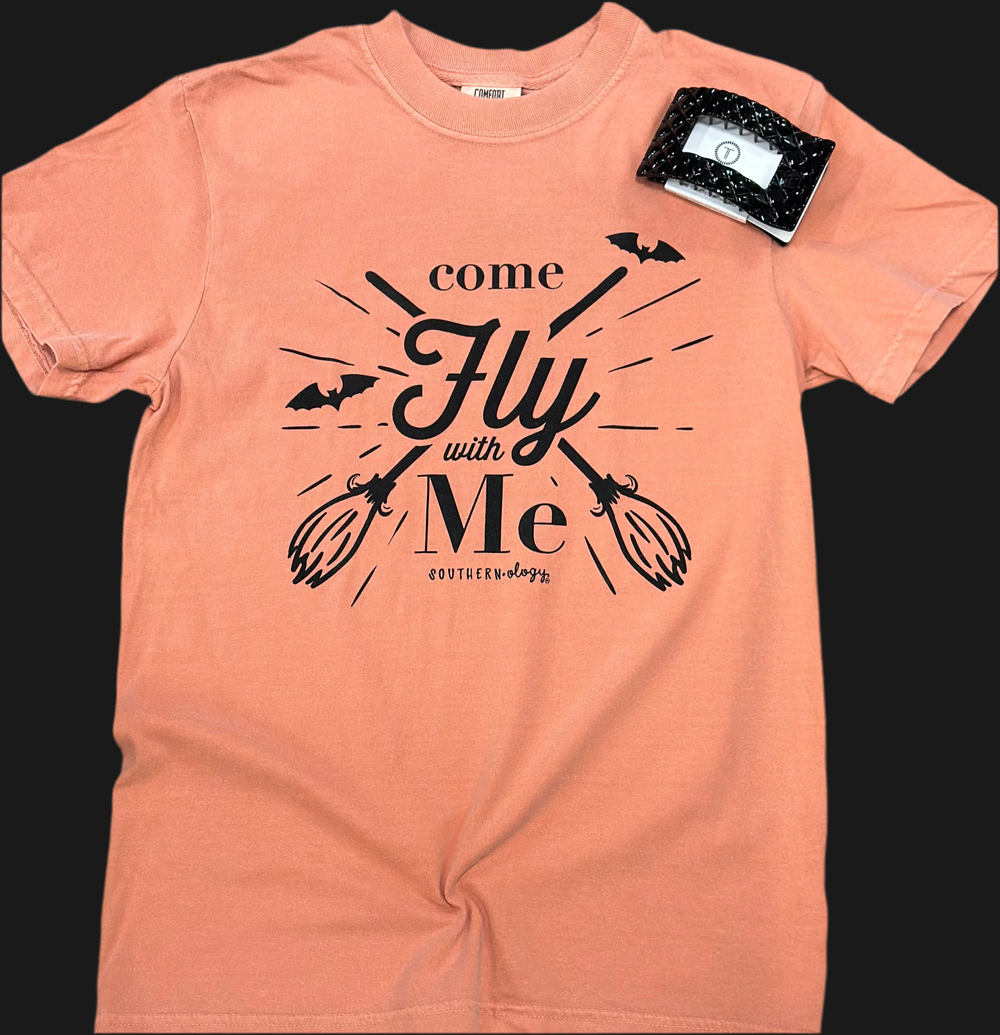 Cast a stylish spell this Halloween with the Southernology® “Come Fly With Me” tee! Featuring spooky-cute artwork, this festive favorite is ready to take your Halloween look to new heights. Whether you’re hitting a haunted hayride, passing out candy, or cozied up with a bowl of popcorn and Hocus Pocus, this tee is the perfect pick.