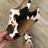 Step up your style with Corky's Carley Wedge in Smooth Cow. Featuring a sleek, classy design and signature Marshmallow soles for all-day comfort.