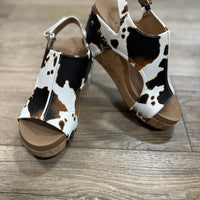 Step up your style with Corky's Carley Wedge in Smooth Cow. Featuring a sleek, classy design and signature Marshmallow soles for all-day comfort. True to size—size up if between sizes! Perfect for any occasion.
