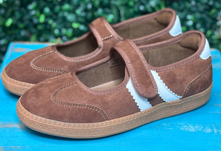 a sporty silhouette with a velcro mary jane strap, squishy footbed, and rich chestnut suede detailing