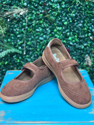 a sporty silhouette with a velcro mary jane strap, squishy footbed, and rich chestnut suede detailing