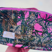 Camouflage-patterned pouch with pink accents 