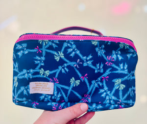 Blue pouch with bow pattern and pink zipper & handle
