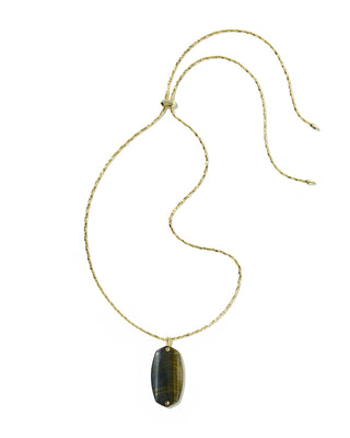 Fit | Long pendant silhouette, designed to layer or wear solo
Material | Brown hawk's eye stone pendant with riveted gold-tone hardware
Finish | Gold-tone metal with riveted detail
Pendant | Brown hawk's eye
Closure | Lobster clasp