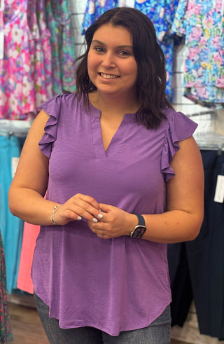 Feminine details, effortless wear. The Lizzy Flutter Top brings together a mandarin collar, pleated back detail, and soft flutter sleeves in a relaxed stretchy knit that moves with you — a wardrobe staple that works as hard as you do.