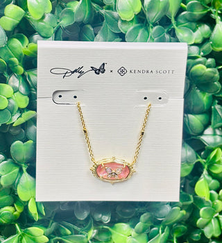 Dolly Parton x Kendra Scott Elisa Butterfly Necklace in gold with light pink iridescent abalone. A delicate pendant inspired by Dolly’s love of butterflies.