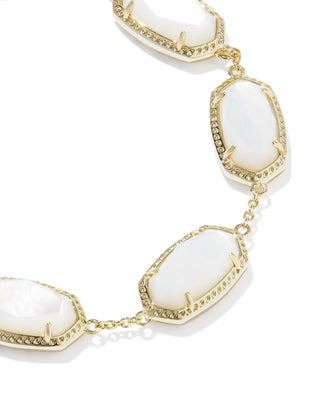 Brand | Kendra Scott
Style | Link Bracelet
Design | Series of signature oval-shaped stones linked together for a sculptural, eye-catching silhouette
Material | Ivory Mother of Pearl
Metal | 14k Yellow Gold Over Brass
Closure | Lobster clasp with a single adjustable slider bead
Size | 6.5" L, 0.38" W with 1.5" extender