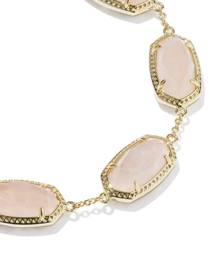 Brand | Kendra Scott
Style | Link Bracelet
Design | Series of signature oval-shaped stones linked together for a sculptural, eye-catching silhouette
Material | Rose Quartz
Metal | 14k Yellow Gold Over Brass
Closure | Lobster clasp with a single adjustable slider bead
Size | 6.5" L, 0.38" W with 1.5" extender
