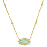 Featuring intricate lattice-inspired metalwork and a luminous ivory mother-of-pearl center, this necklace brings artistic elegance to any look. Whether worn solo or layered in a stack, it’s a timeless piece you'll reach for again and again.