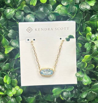 Elisa Luxe Short Pendant Necklace Gold Light Blue with oval cubic zirconia on gold paperclip chain.