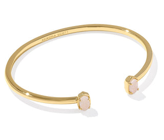 Stone | Iridescent Drusy
Finish | Gold tone
Design | Minimalist cuff bookended by Kendra Scott's Emilie micro icon
Inner Diameter | 2.83"
Station Size | 0.32" L x 0.2" W
Fit | Adjustable cuff