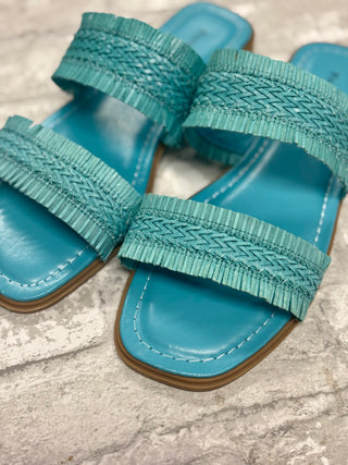 Empress Sandal - Turquoise
Step into spring and summer with ease in our Empress Sandals in Turquoise! These slide-on beauties feature a gorgeous double woven strap, adding the perfect touch of texture and fun to any outfit. 
Effortlessly stylish and oh-so-comfy, they’re a must-have for the sunny season!
Pierre Dumas Shoe 
Square toe shoe 
Flat sole 
woven strap detail