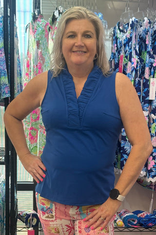 The top you'll style a hundred different ways. The Evelyn Sleeveless Top features a feminine ruffle V-neckline and a flattering silhouette that transitions effortlessly from a morning outing to an evening on the patio. Lightweight, breathable, and wrinkle-free with UPF50+ sun protection built right in — it's the kind of top that earns a permanent spot in your travel wardrobe.