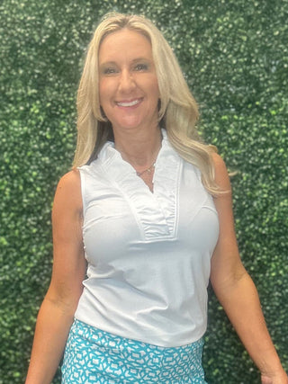 The top you'll style a hundred different ways. The Evelyn Sleeveless Top features a feminine ruffle V-neckline and a flattering silhouette that transitions effortlessly from a morning outing to an evening on the patio. Lightweight, breathable, and wrinkle-free with UPF50+ sun protection built right in — it's the kind of top that earns a permanent spot in your travel wardrobe.