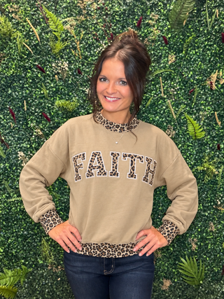Fit | Relaxed, easy pullover silhouette
Fabric Feel | Soft 50% polyester and 50% cotton blend
Neckline | Crew neckline with leopard-print trim
Sleeves | Long sleeves with leopard-print cuffs
Design | Oversized FAITH lettering with leopard-print detail
Hem | Leopard-print contrast hem
