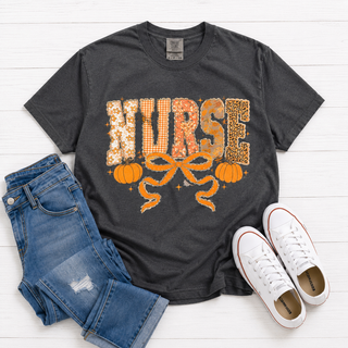 Fall Nurse Tee
Printed on a pepper grey comfort colors tee. Nurse coquette bow design with pumpkins.