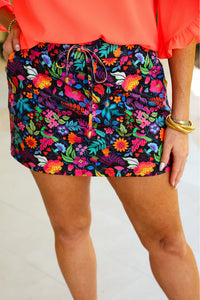 Start a style conversation with this playful multi-colored floral skort. Made with lightweight fabric, it features an elastic band on the back and built-in shorts to keep you comfortable yet totally on-trend. Side pockets and a drawstring add a practical finishing touch to the fun vibe.

Fabric: 85% Polyester/15% Spandex