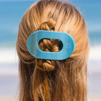 The TELETIES Flat Round Hair Clip offers a comfy, secure hold for any hair type. Nearly unbreakable and perfect for lounging or yoga. Shop now!

