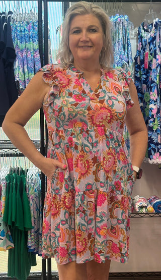 Floral Flutter Sleeve Tiered Dress
Effortlessly feminine from hem to flutter. This tiered dress features a multi-color floral print from top to bottom, with delicate flutter sleeves that add a breezy, romantic touch — the kind of dress that turns heads without trying.