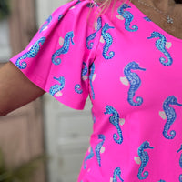 Lulu-B Short Sleeve V-Neck Frill Top in Seahorse Hot Pink with SPF 50 fabric, breathable comfort, and frill details for a stylish, sun-safe look.