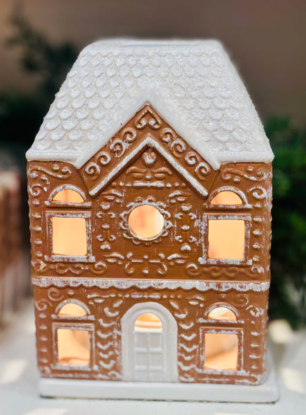 Festive Gingerbread House Fragrance Warmer with top-down wax warming and cozy canopy glow. Includes bulb. Flame-free, safe, and perfect for holiday décor.
