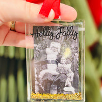 Acrylic glitter-filled photo ornament fits a wallet-size picture. A festive way to display cherished memories on your Christmas tree.