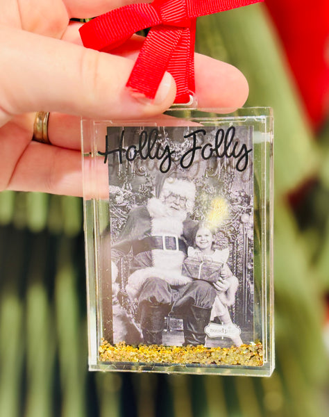 Acrylic glitter-filled photo ornament fits a wallet-size picture. A festive way to display cherished memories on your Christmas tree.