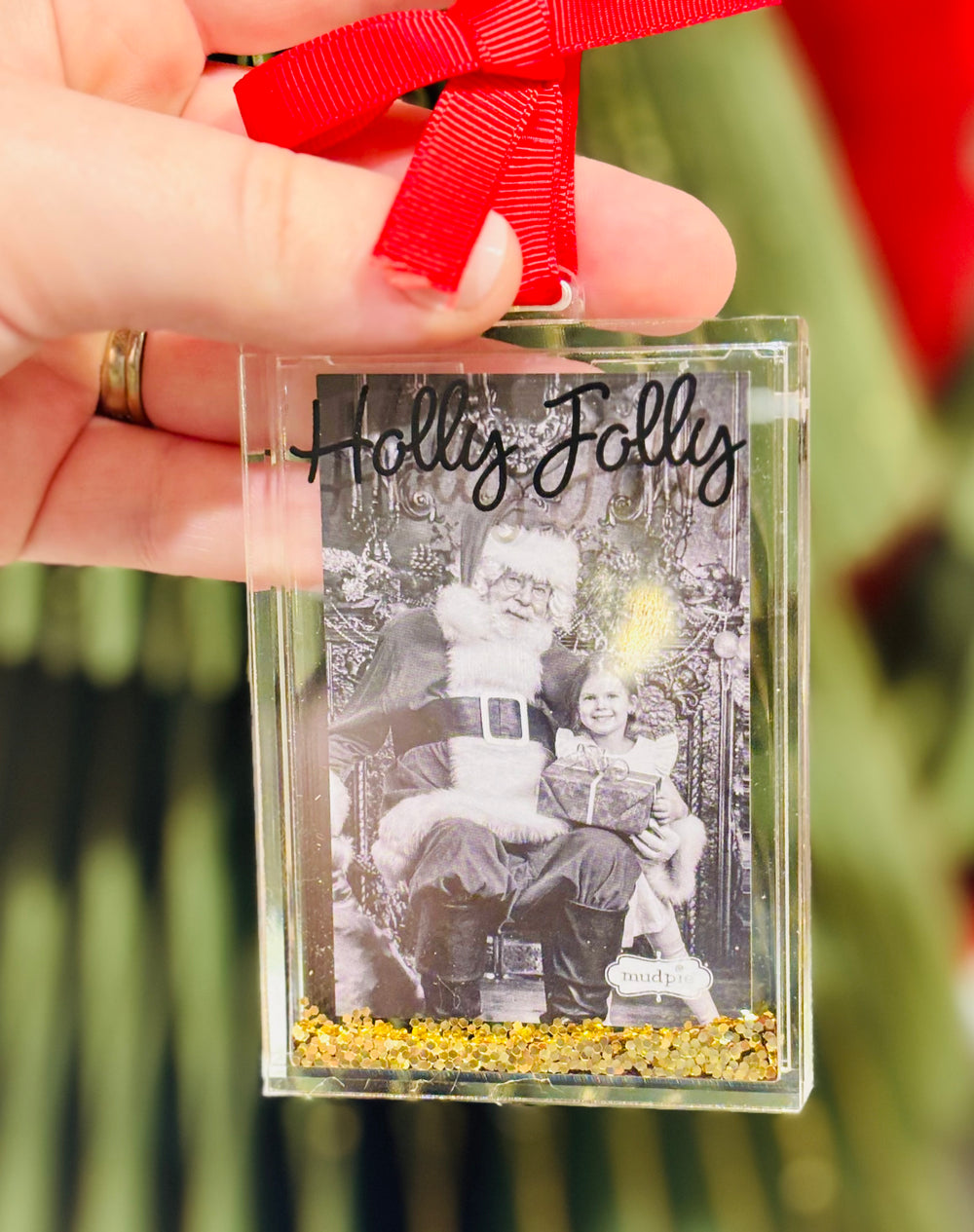 Acrylic glitter-filled photo ornament fits a wallet-size picture. A festive way to display cherished memories on your Christmas tree.