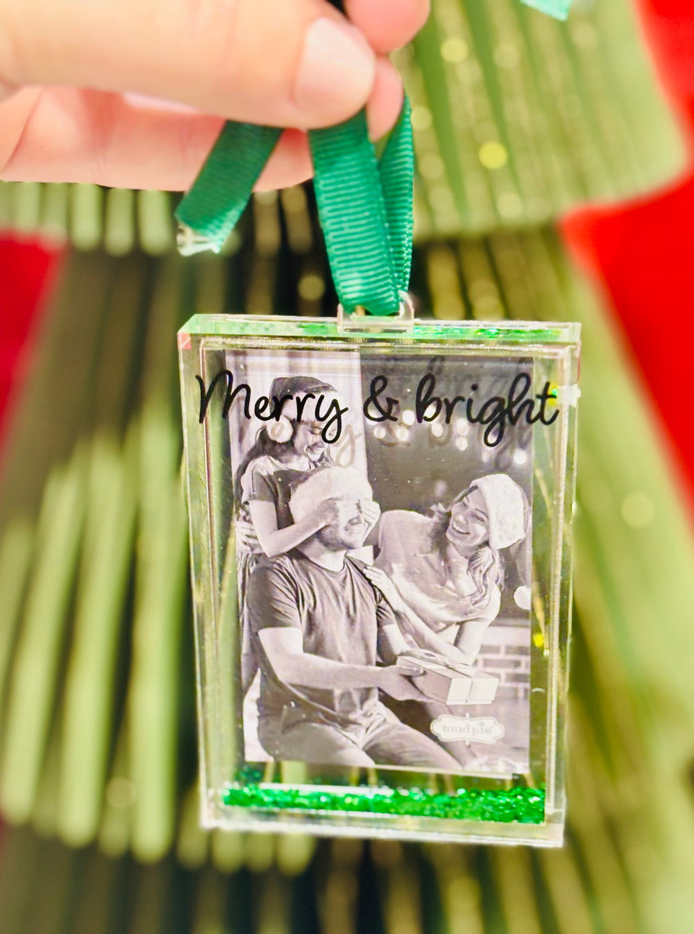 Acrylic glitter-filled photo ornament fits a wallet-size picture. A festive way to display cherished memories on your Christmas tree.