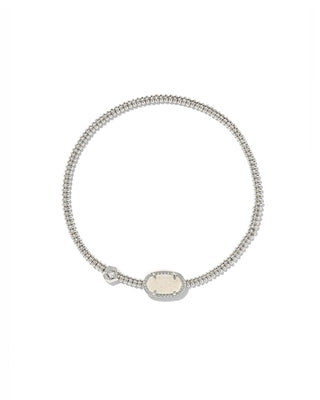 Brand | Kendra Scott
Finish | Silver tone
Material | Iridescent Drusy
Design | Grayson signature-shaped station
Fit | Slip-on stretch design
Size | 6.5-inch unstretched circumference
Station | 0.41 inch long by 0.22 inch wide
Care | To help protect the finish, avoid water, perfume, and lotions; gently wipe with a soft cloth after wear.