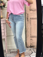 Elevate your style with our High-Rise Crop Flare Side Step Jeans. With an 11" rise and 27" inseam in size 3/26, these jeans offer a flattering fit. Made from a comfortable blend of cotton, polyester, and spandex, these jeans are perfect for any occasion. Available in light wash.
