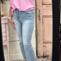 Elevate your style with our High-Rise Crop Flare Side Step Jeans. With an 11" rise and 27" inseam in size 3/26, these jeans offer a flattering fit. Made from a comfortable blend of cotton, polyester, and spandex, these jeans are perfect for any occasion. Available in light wash.