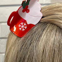 Add a cozy, playful touch to your hairstyle with the Hot Chocolate Claw Clip. This 3x2 acrylic claw clip is perfect for keeping hair stylishly in place while adding a fun seasonal vibe. Lightweight, durable, and easy to wear, it’s a must-have accessory for the holiday season.