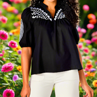 Cotton V-neck top features embroidery detail at chest and short sleeves