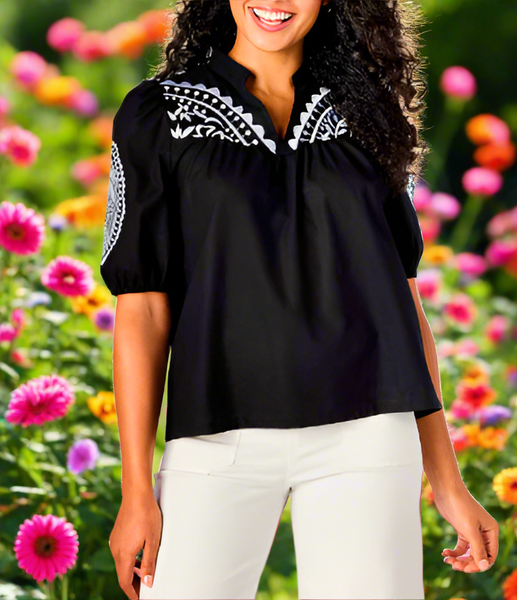 Cotton V-neck top features embroidery detail at chest and short sleeves