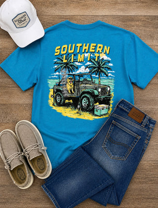 Turquoise mens tee with dog sitting in a jeep.