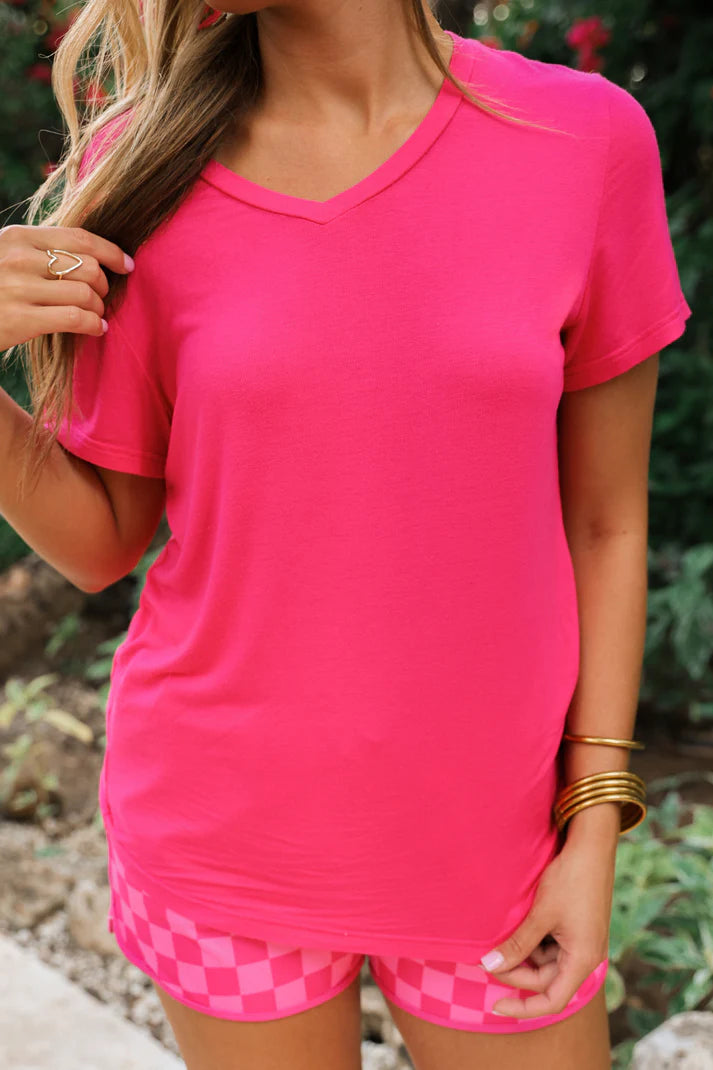 We know we're always on the lookout for a good, comfy basic! This basic tee is definitely one of those pieces! It's comfy and a perfect fit that makes it so easy to wear and the colors make styling and layering it a breeze! This top features short sleeves, a v-neck, and a rounded hemline