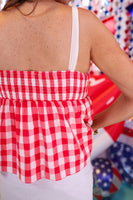 Add sweetness to your style with our Sweet As Apple Pie Top! This plaid, patriotic babydoll top has tie straps & a smocked back—perfect for summer fun!
